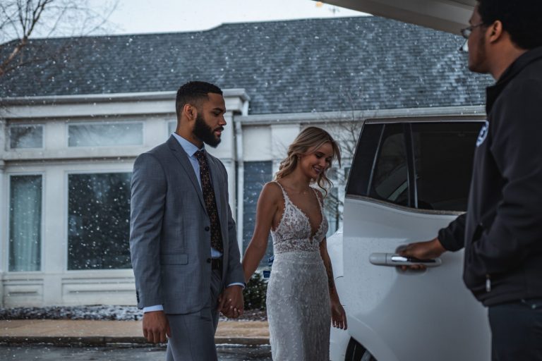Avant Garde Limousines & Coach Wedding Transportation Pickup from Hawthorne's After Reception On Side of Vehicle